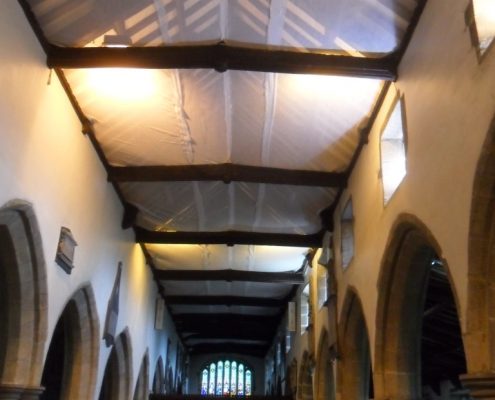 Finished netting installation along length of the church