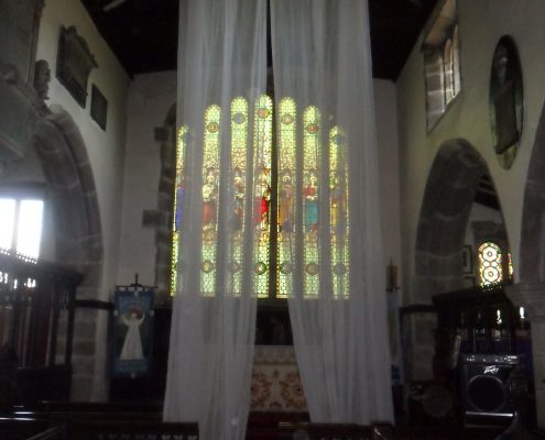 Ceiling netting hanging in front of the east window